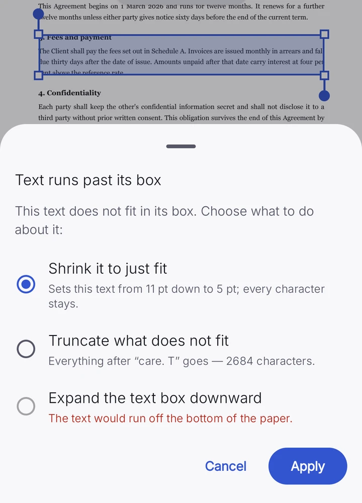 Text that no longer fits its box raises a drawer offering to shrink it to fit, truncate it, or expand the box downward